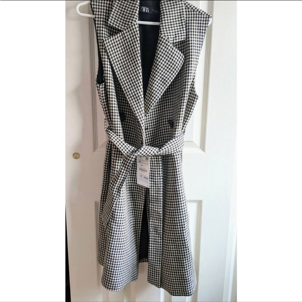 gingham vest coat. the tag is not included anymore. i took it down. new coat
